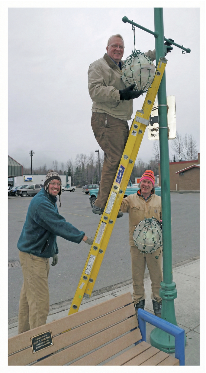 Northeast Community Council volunteers hang decorative lighting from the green lamp posts along Muldoon Rd and Debarr Rd.
This annual tradition brought holiday cheer to Northeast Anchorage for decades.