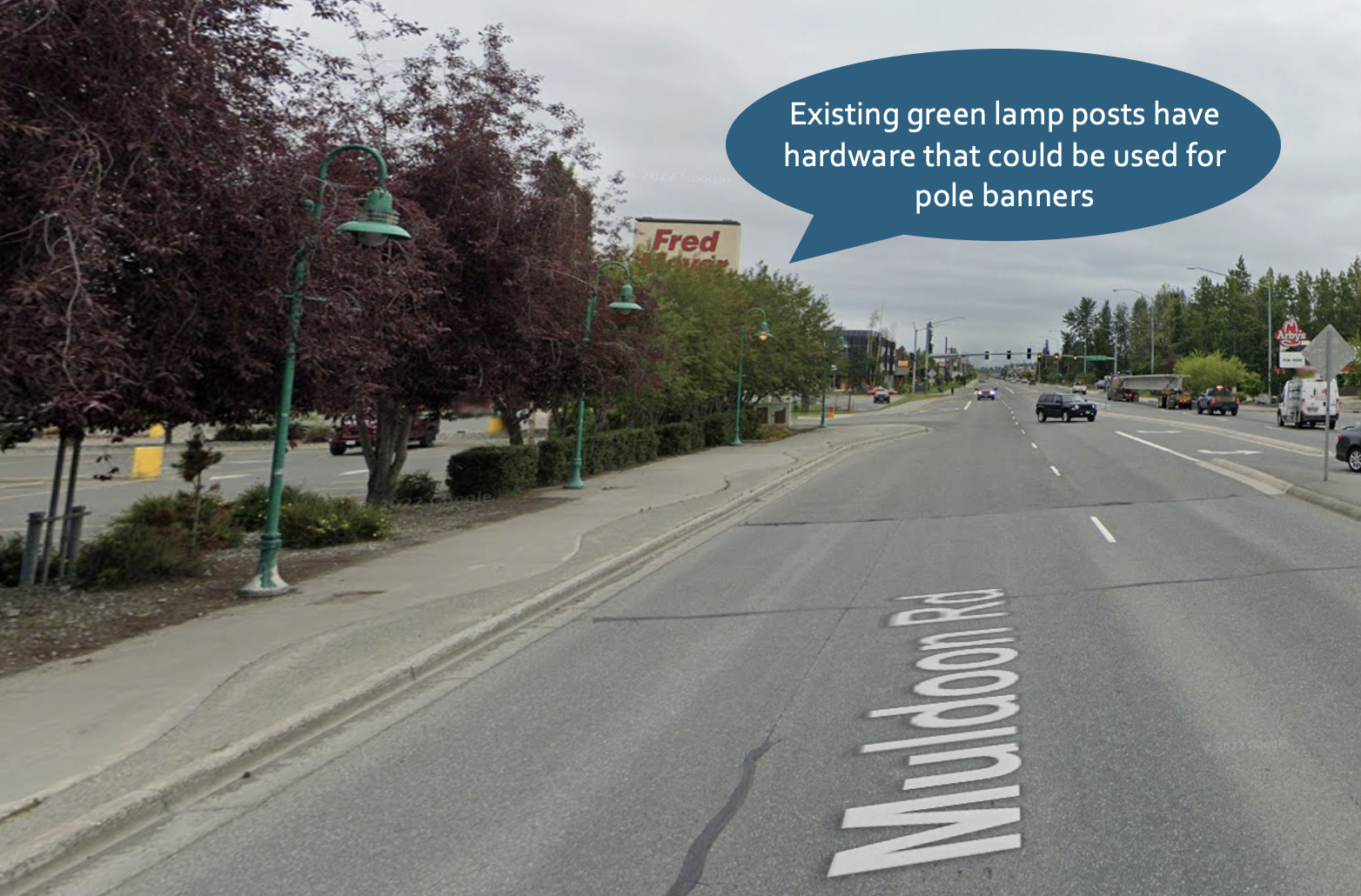 Existing green street lights have hardware for lights and pole banners