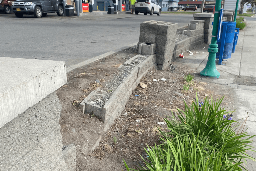 crumbling Muldoon Road wall in Northeast Anchorage